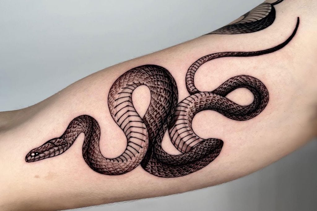 Snake tattoo on hand