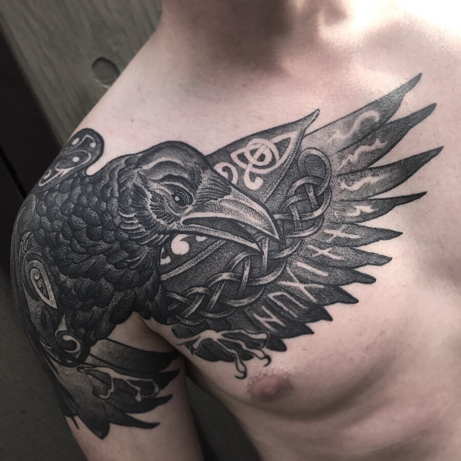 celtic raven tattoo on man's shoulder